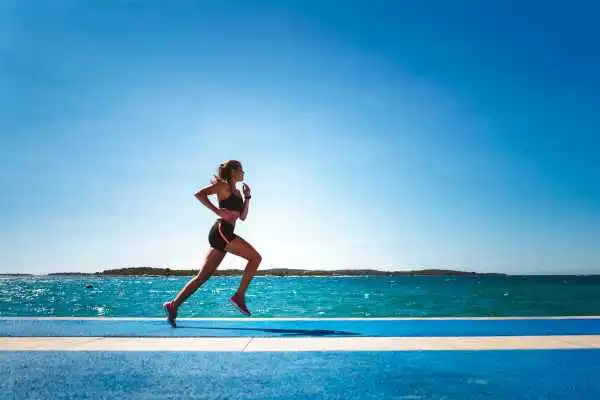 Woman running showing strong leg muscle Melksham